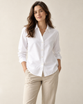 Woman wearing Solenne classic button-front shirt in white