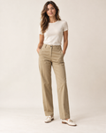 Woman wearing Solenne tailored chino trousers in sand